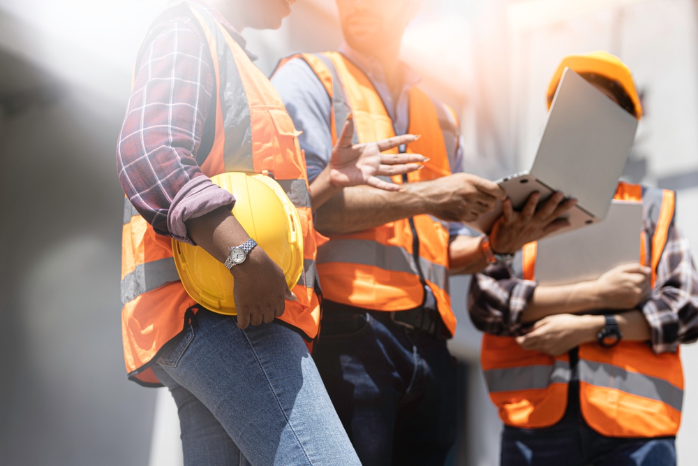 Construction contractors coordinating on site
